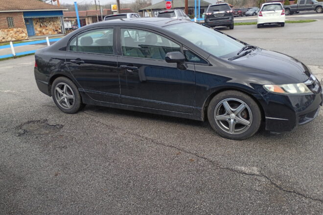 Black 2010 Honda Civic four-door sedan profile