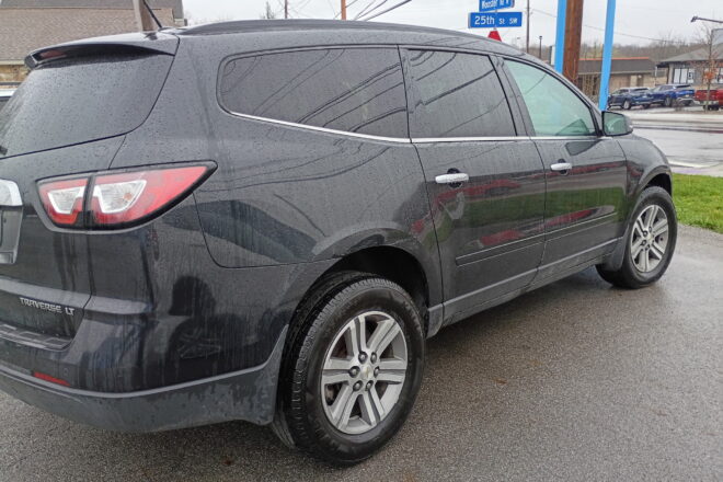 Black 2015 Chevy Traverse LT rear profile view