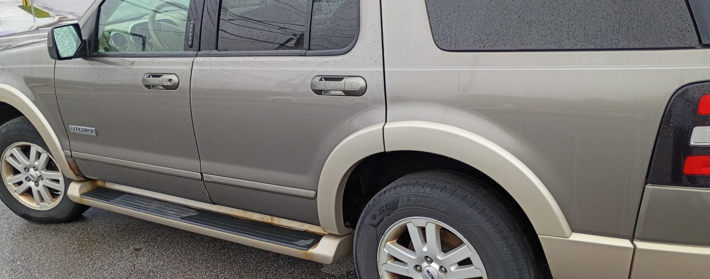 Tan 2006 Ford Explorer side profile